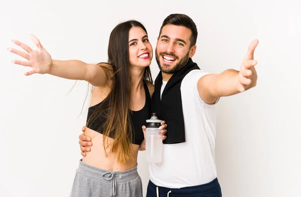 Young Caucasian Fitness Couple Isolated Feels Confident Giving Hug Camera — Stock Photo, Image