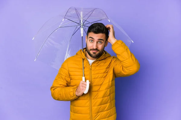 Joven Hombre Guapo Sosteniendo Paraguas Aislado Siendo Sorprendido Ella Recordado — Foto de Stock