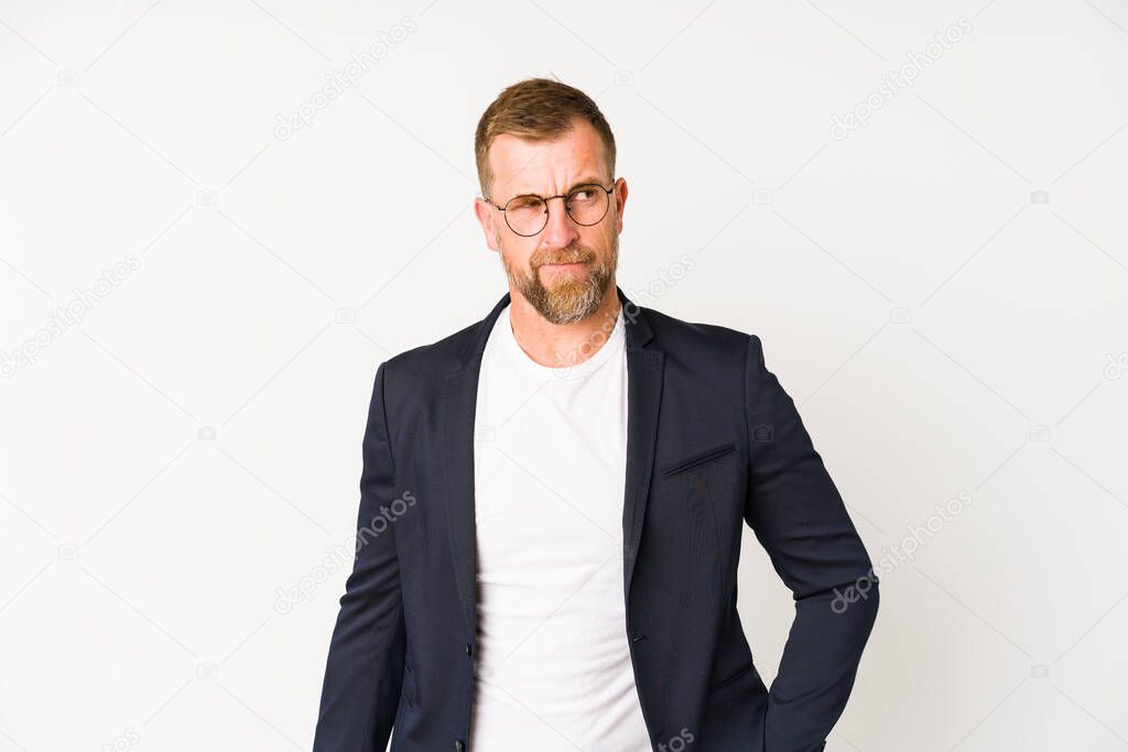 Senior business man isolated on white background confused, feels doubtful and unsure.
