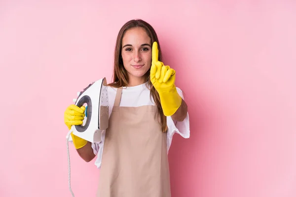 Young Caucasian Woman Clothes Iron Isolated Showing Number One Finger — Stock Photo, Image