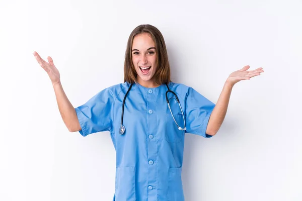 Young Nurse Woman Isolated Receiving Pleasant Surprise Excited Raising Hands — Stock Photo, Image