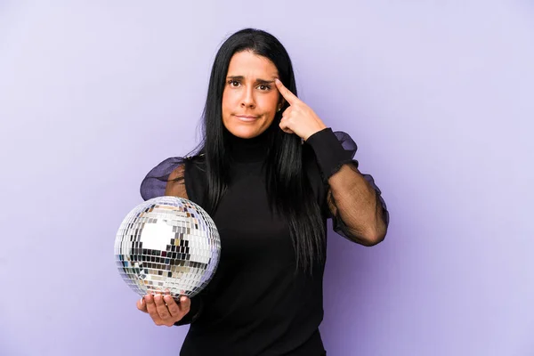 Woman Holding Ball Party Isolated Purple Background Showing Disappointment Gesture — Stock Photo, Image