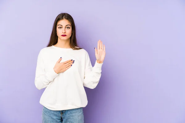 Young Caucasian Woman Isolated Purple Background Taking Oath Putting Hand — Stock Photo, Image