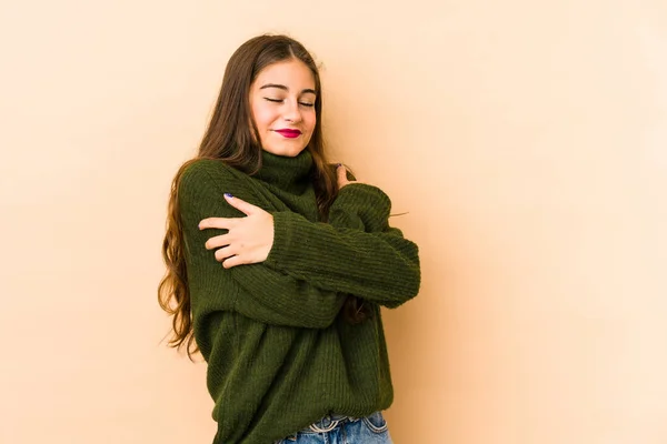 Young Caucasian Woman Isolated Beige Background Hugs Smiling Carefree Happy — Stock Photo, Image