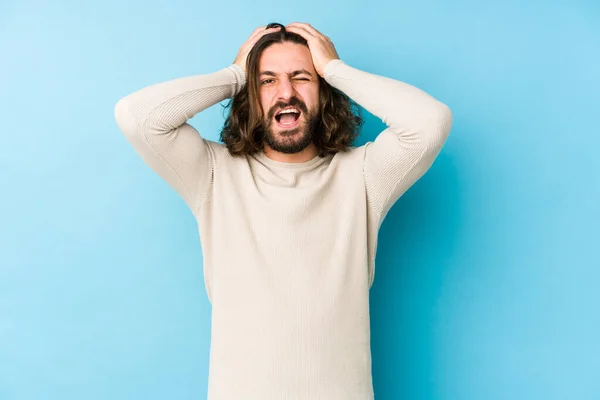 Young Long Hair Man Isolated Blue Background Laughs Joyfully Keeping — Stock Photo, Image