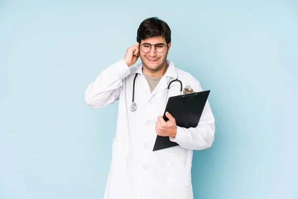 Young Doctor Man Isolated Blue Background Covering Ears Hands — Stock Photo, Image