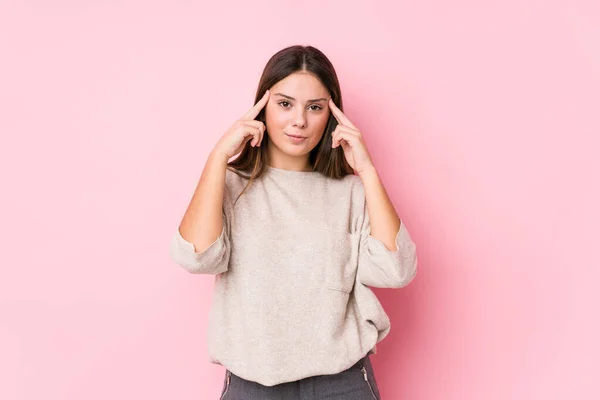 Young Caucasian Woman Posing Isolated Focused Task Keeping Forefingers Pointing — Stock Photo, Image