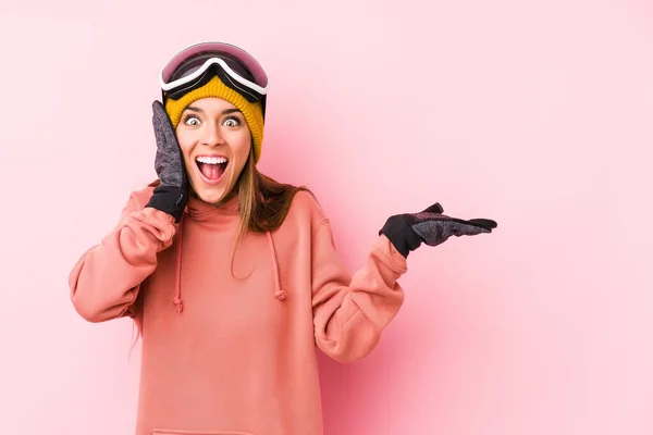 Young Caucasian Woman Wearing Ski Clothes Isolated Holds Copy Space — 스톡 사진