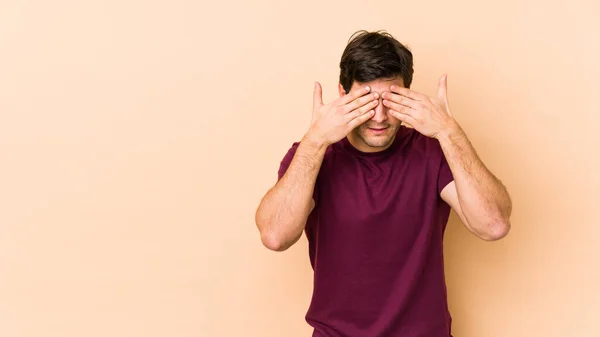 Young Man Isolated Beige Background Afraid Covering Eyes Hands — Stock Photo, Image