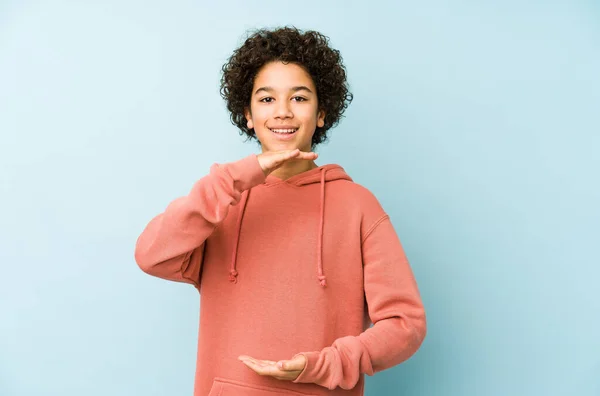 African American Little Boy Isolated Holding Something Both Hands Product — Stock Photo, Image