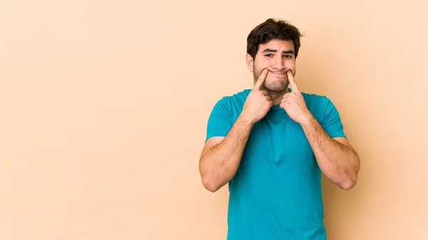 Young Man Isolated Beige Background Doubting Two Options — Stock Photo, Image
