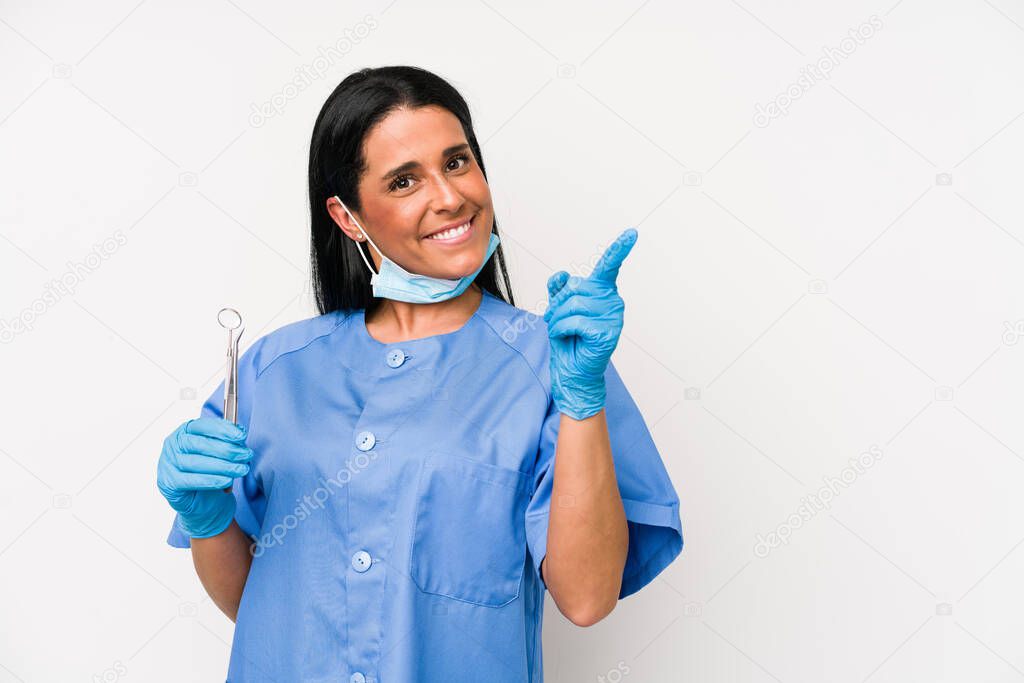 Dentist woman isolated on white background showing number one with finger.