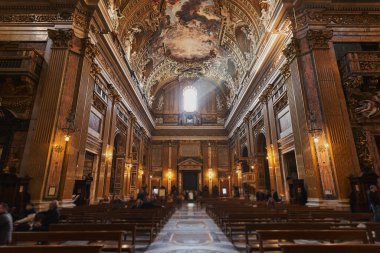 Church of the Gesu interior in Rome from the central aisle with benches on the sides clipart