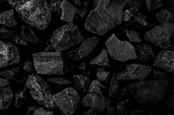 Natural fire ashes with dark black coals texture. It is a flammable black hard rocks. Space for text