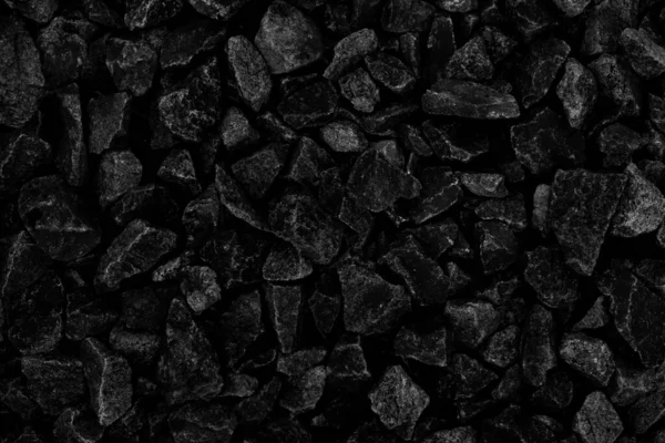 Natural fire ashes with dark black coals texture. It is a flammable black hard rocks. Space for text