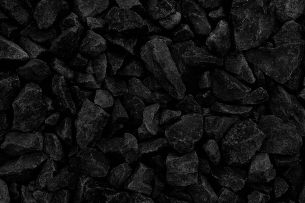Естественный пепел огня с темно-черными углями текстуры. Это легковоспламеняющиеся черные твердые камни. Пространство для текста
