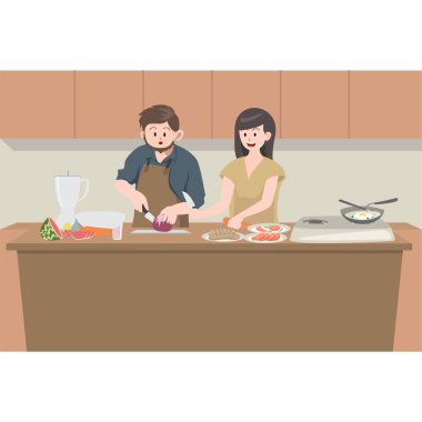 Babam mutfakta annemden yemek yapmayı öğreniyor.