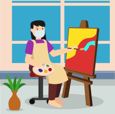 Bir kadın resim yaparken tıbbi maske takıyor.