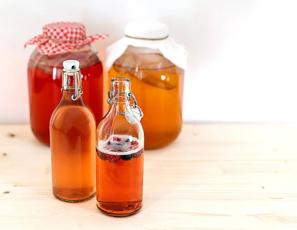 Homemade fermented kombucha tea in glass jars and bottles — Stock Photo, Image