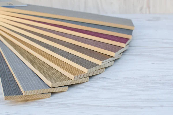 Color wood samples.Catalog of wood materials for design on a light background.Collection of surface boards. Wood color and texture samples.Paint with silver.Brilliant spraying