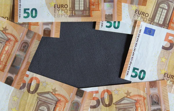 Euro banknotes on a black background - wealth