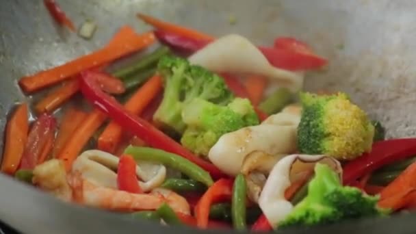 Chef Fries Vegetables Squid Shrimp Wok Pan — Stock Video