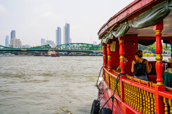 Bangkok, Thailand - March 17, 2019: Chao Phraya River in Bangkok, Thailand, with monuments, skyscrapers, taxi boats and temples