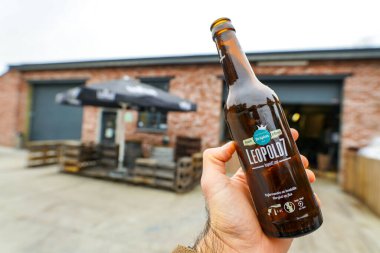 HERON, BELGIUM - NOVEMBER 9, 2019: Belgian Leopold 7 beer. Premium craft beer made of 3 hops and the Leopold Touch. Belgian beer brewery. clipart
