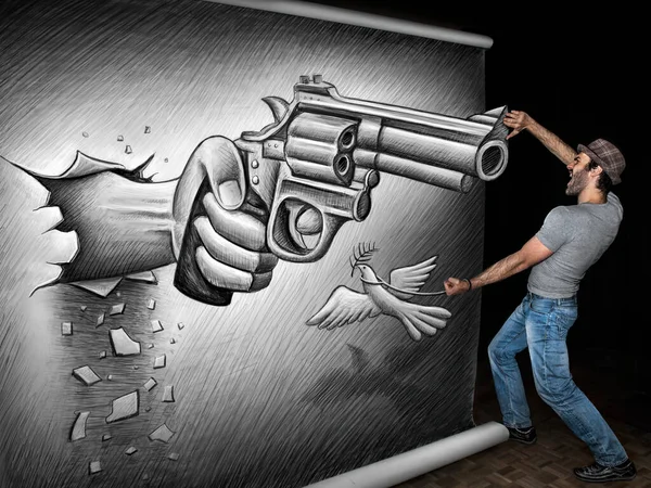 Человек Стоит Кричит Поднимает Руку Против Гигантского Рисунка Пистолета — стоковое фото