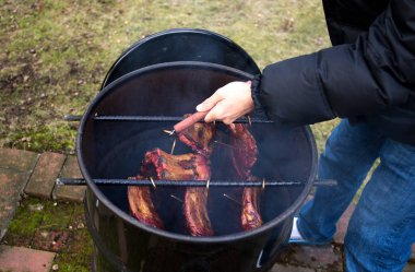 Man roasted barbecue smoke spare ribs  clipart