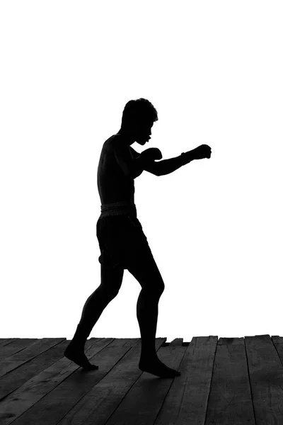 Homem exercitando boxe tailandês em silhueta isolada — Fotografia de Stock