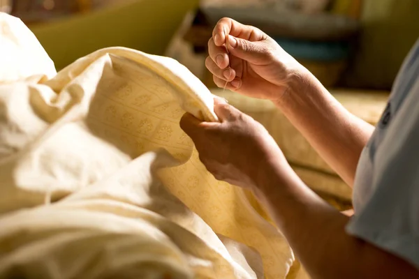 Woman handmade sewing thread blanket