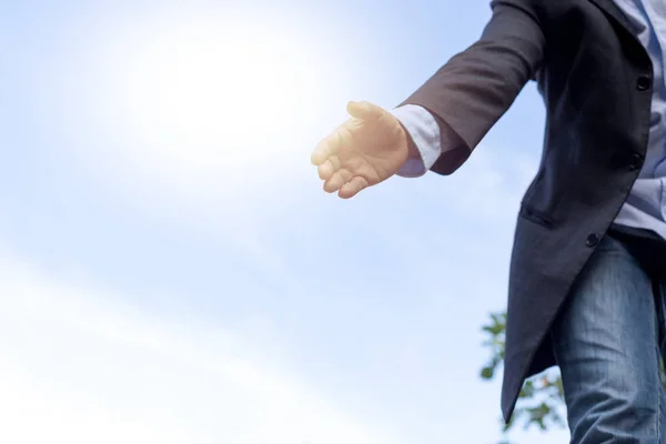 Help concept hand reaching out to help someone with sunlight — Stock Photo, Image