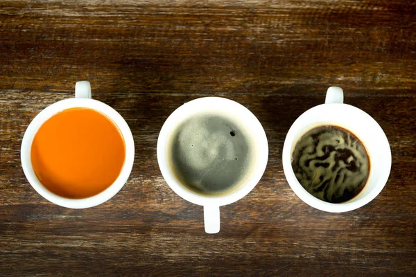 Concept and idea cup of coffee and tea line up — Stock Photo, Image