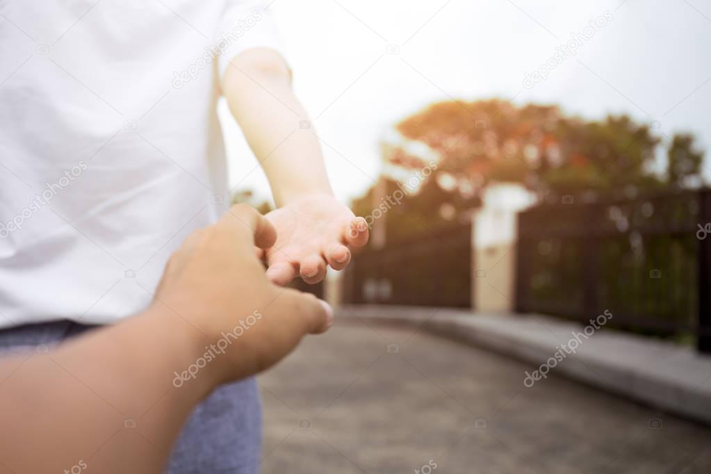 Man and woman hand reaching to each other 