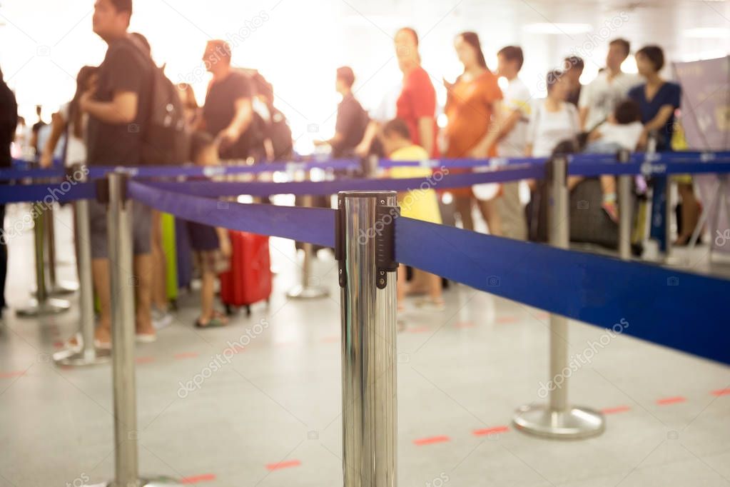 passengers check-in line at the airport