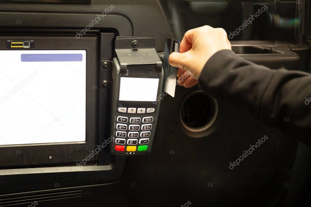 Passenger paying taxi fare with credit card 