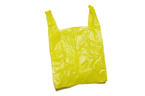 Lege gele plastic zak geïsoleerd in clipping pad. Stockfoto