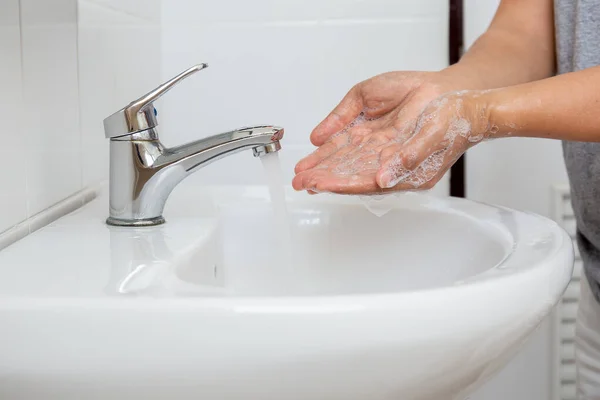 Man Washing hands with for corona virus prevention