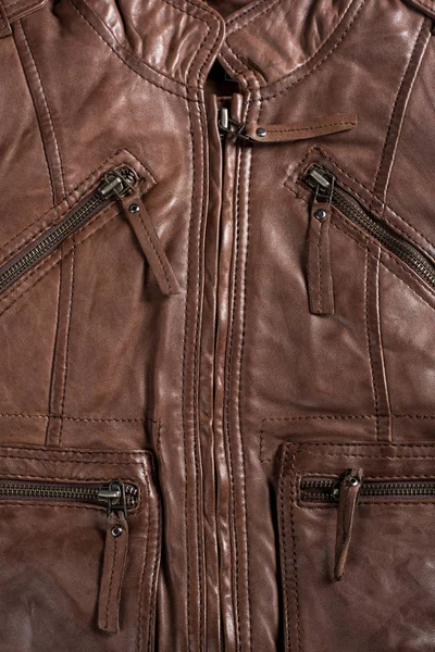 Chaqueta de cuero con textura marrón. Chaqueta de cuero macro detalles . — Foto de Stock