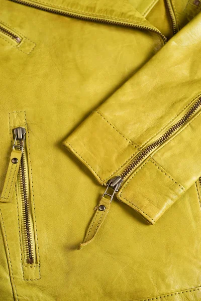 Green leather jacket zippers. Leather jacket macro details.