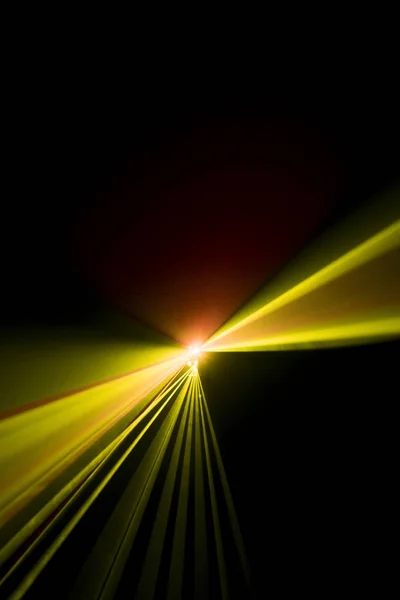 Laser beam yellow on a black background