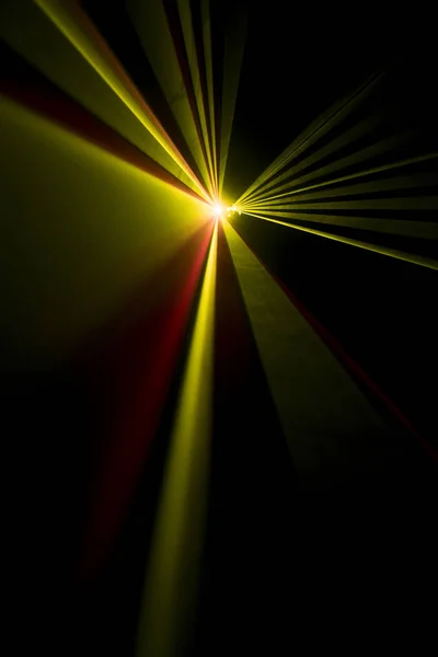 Laser beam yellow on a black background — Stock Photo, Image