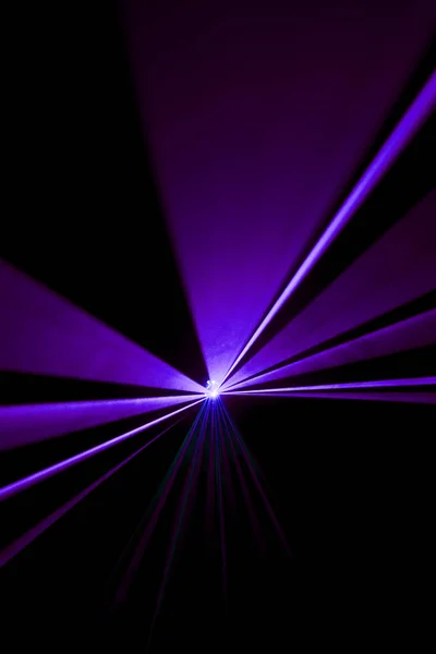 Laser beam purple on a black background