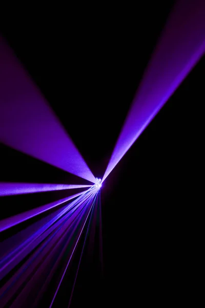 Laser beam purple on a black background — Stock Photo, Image