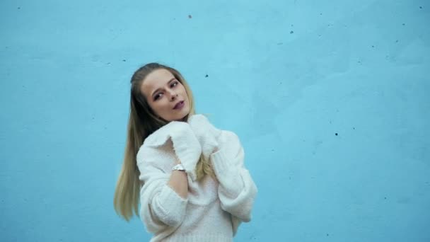 Attractive Slim Girl Long Hair White Sweater Posing Blue Wall — Stock Video