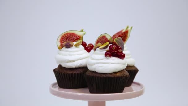 Close View Three Spinning Cupcakes Decorated White Cream Cheese Red — Stock Video