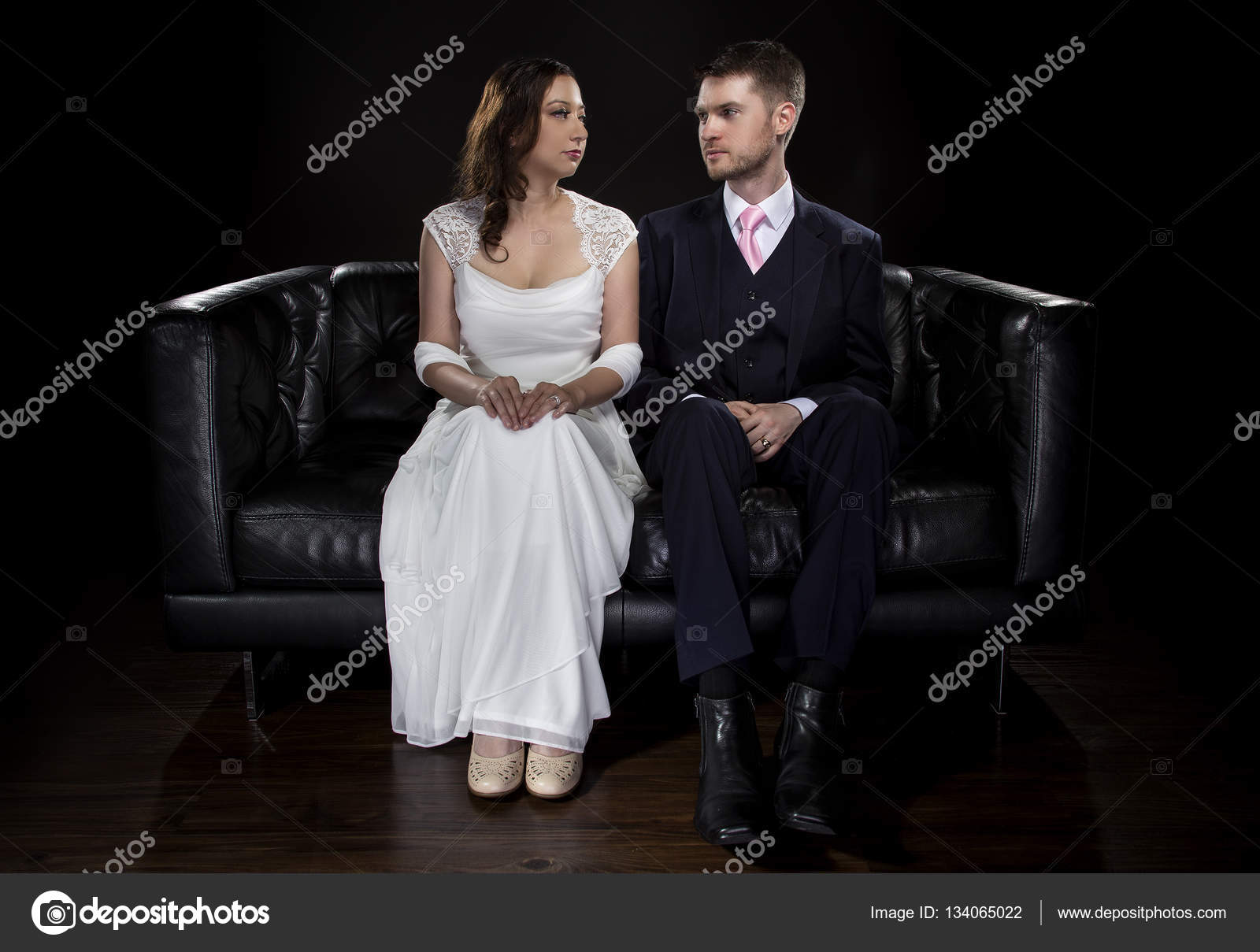 Engaged Couple Modeling Stylish Wedding Suit and Wedding Dress