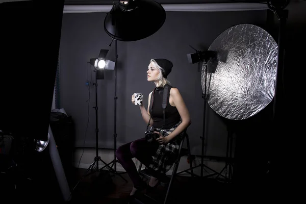 Hipster Photographer Drinking Coffee in a Studio — Stock Photo, Image