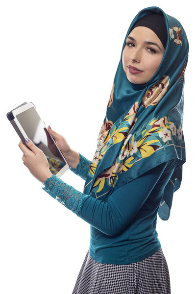 Female in Hijab using a Tablet